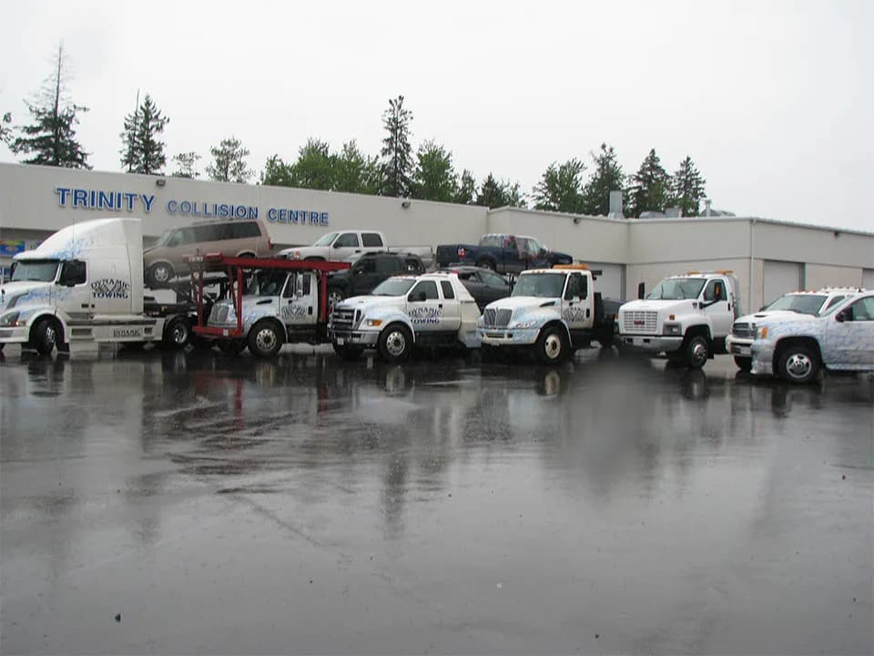 Dynamic Towing fleet — flat decks, wheel lifts, and heavy-duty wreckers at the Moncton yard