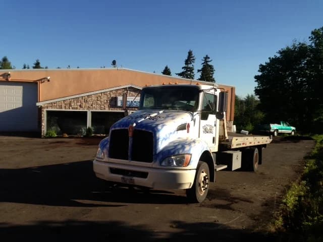Dynamic Towing Kenworth flat-deck parked at the Beaverbrook St shop